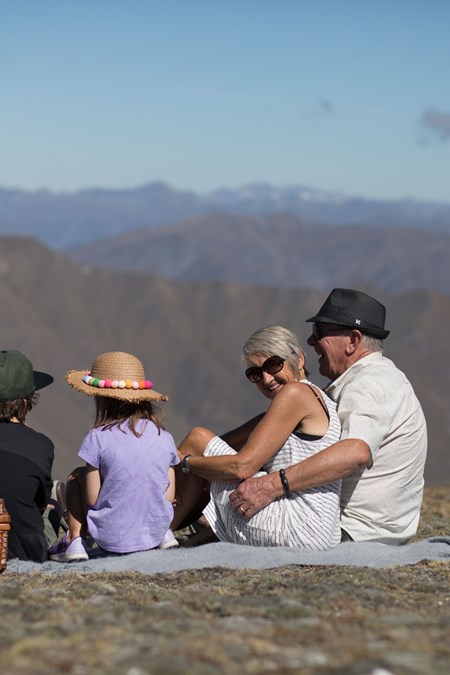 family picnic with view of southern alps at cardrona